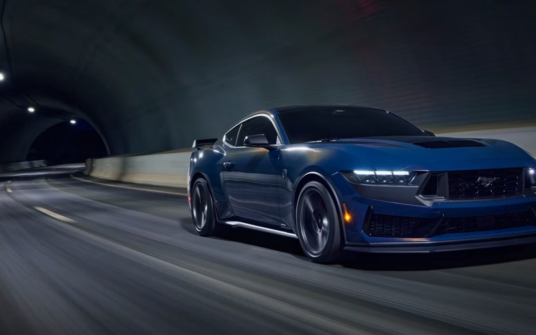 Blue Ford Mustang performance coupe driving through a tunnel